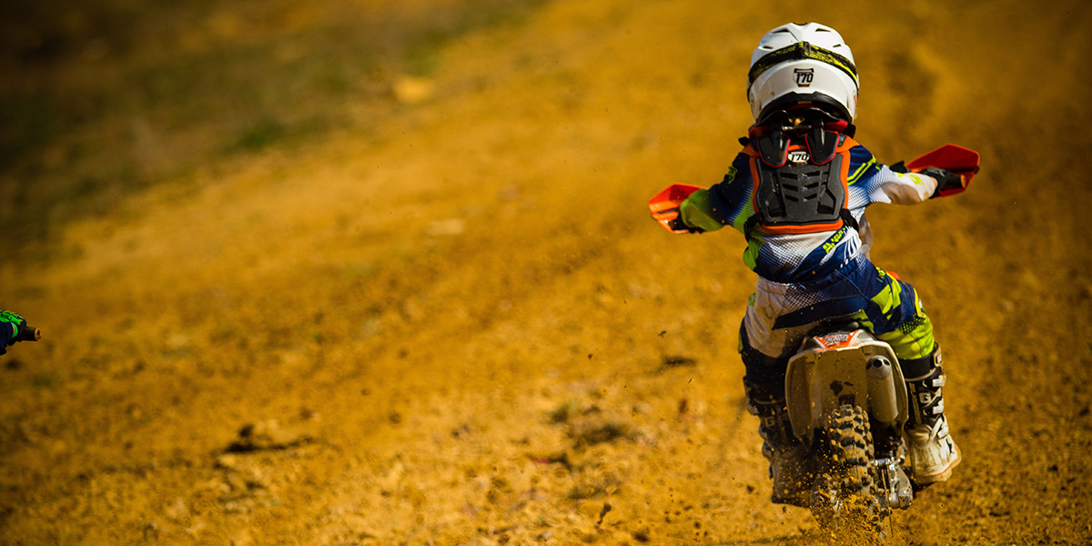 Kid off road riding on bike