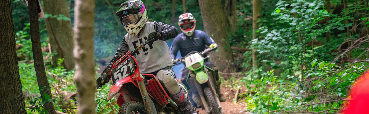 2 motorcyclists trail riding